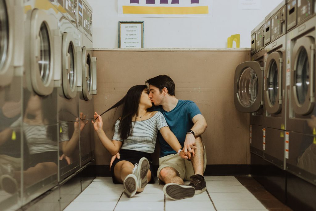 kansas city engagement session location couple at laundromat