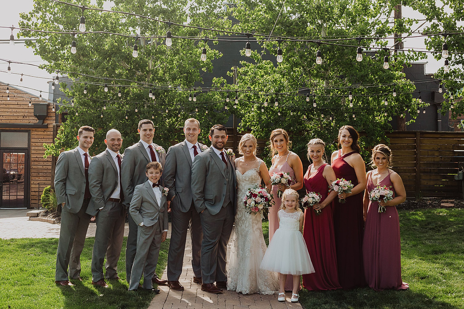Bridal party in red and grey portraits from Kansas City Wedding at The Guild Photographed by Caitlyn Cloud Photography
