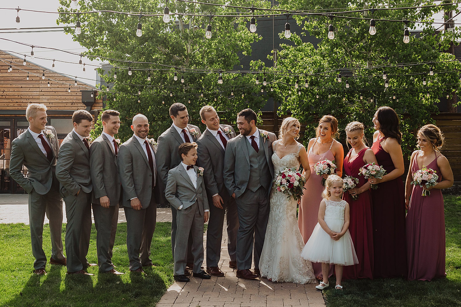 Bridal party in red and grey portraits from Kansas City Wedding at The Guild Photographed by Caitlyn Cloud Photography