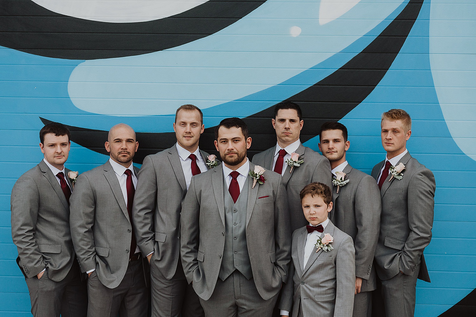 Groom and groomsmen in grey portraits from Kansas City Wedding at The Guild Photographed by Caitlyn Cloud Photography