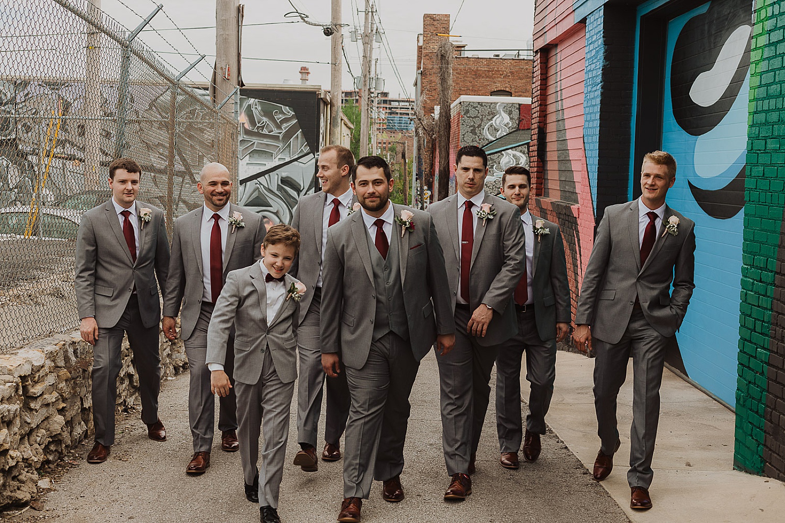 Groom and groomsmen in grey portraits from Kansas City Wedding at The Guild Photographed by Caitlyn Cloud Photography