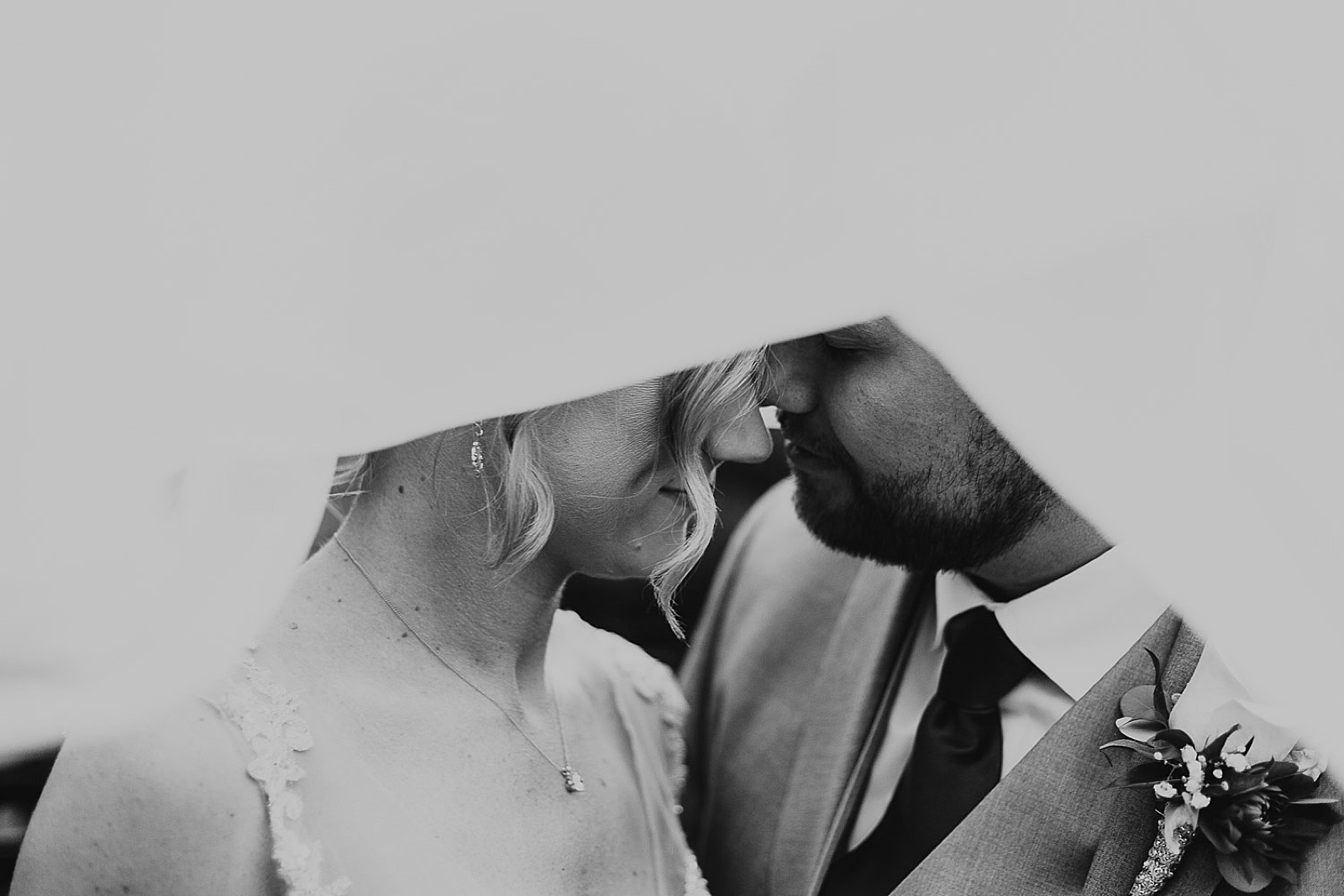 Bride and groom under veil from Kansas City Wedding at The Guild Photographed by Caitlyn Cloud Photography