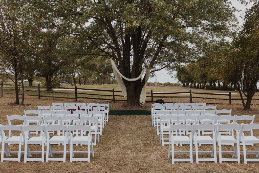 Backyard wedding tree arbor ceremony space