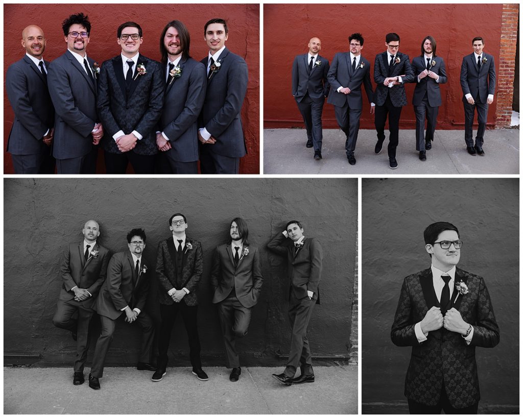 groom and groomsmen photos in front of a red brick wall