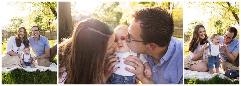 Mom, 6 month old baby boy, and Dad sitting on a blanket in the backyard with the sunset coming through the trees behind them